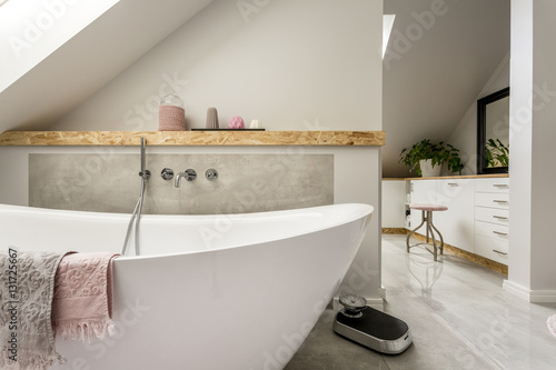 Freestanding bath in grey bathroom photo