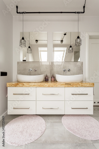 Two sinks and cabinet in bathroom