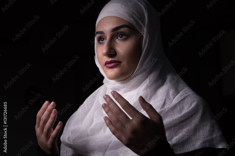 Muslim woman praying and reading Koran in Mosque Stock Photo Adobe Stock
