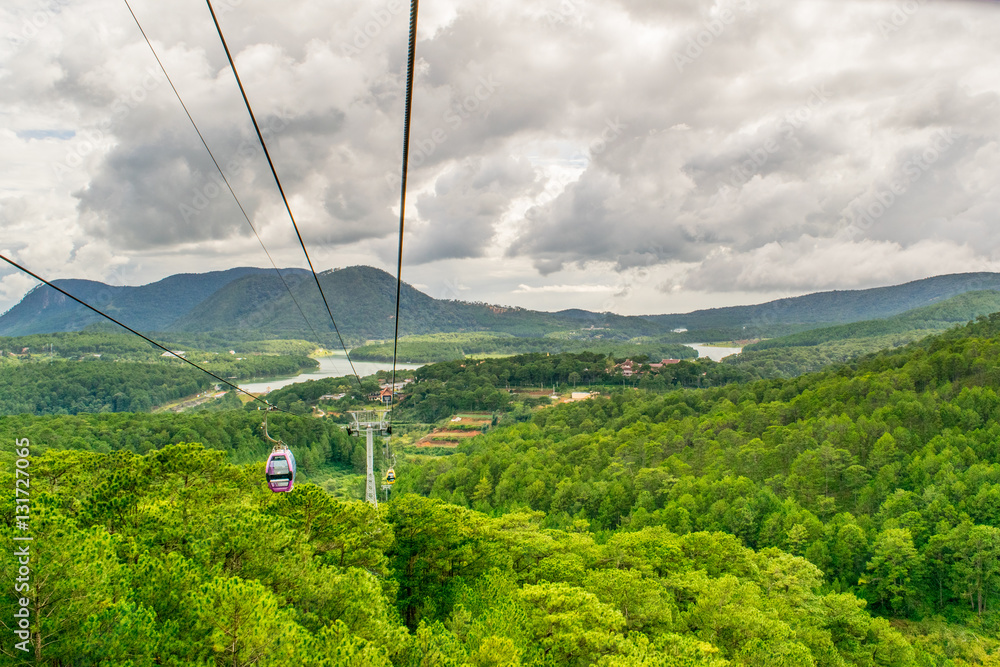 Cable car under pine forest in mountains in Vietnam, Dalat city