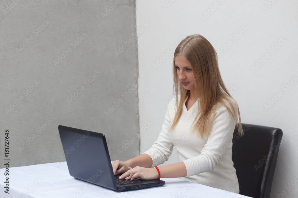 Business woman working in office, typing on laptop Business woman working in office, typing on laptop