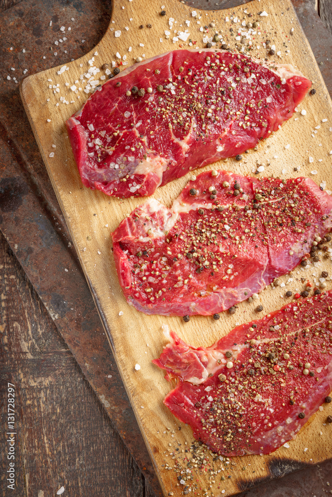 Fresh beef steak and spicel on board Fresh beef steak and spicel on board