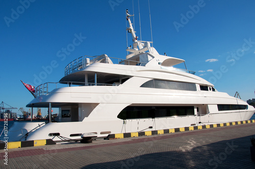 White yacht in the port waiting. On the sea is calm. © Ms VectorPlus
