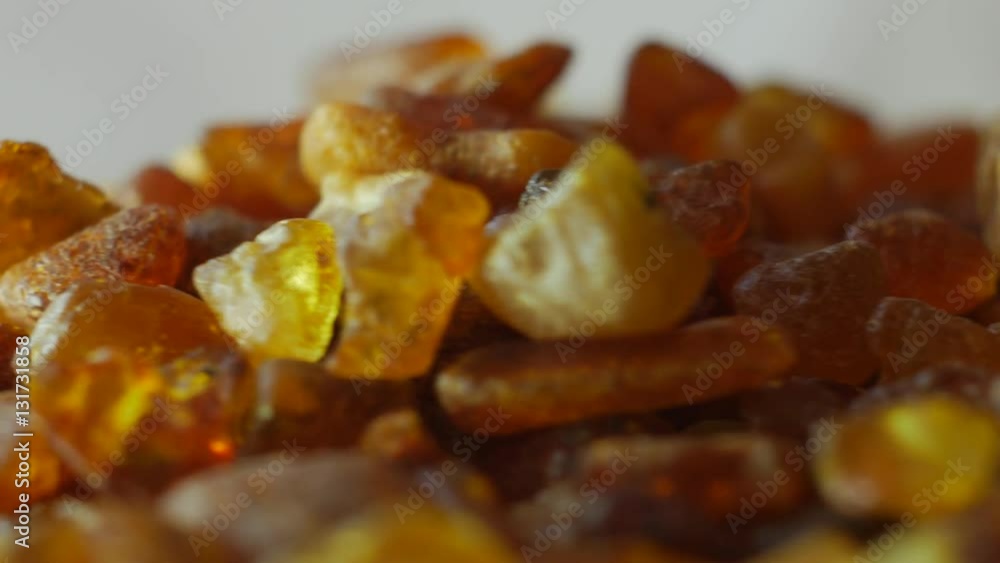 Beautiful Fiery Amber In Macro. From the Baltic Sea, Lithuania. Rotating on the table. Beautiful Fiery Amber In Macro. From the Baltic Sea, Lithuania. Rotating on the table.