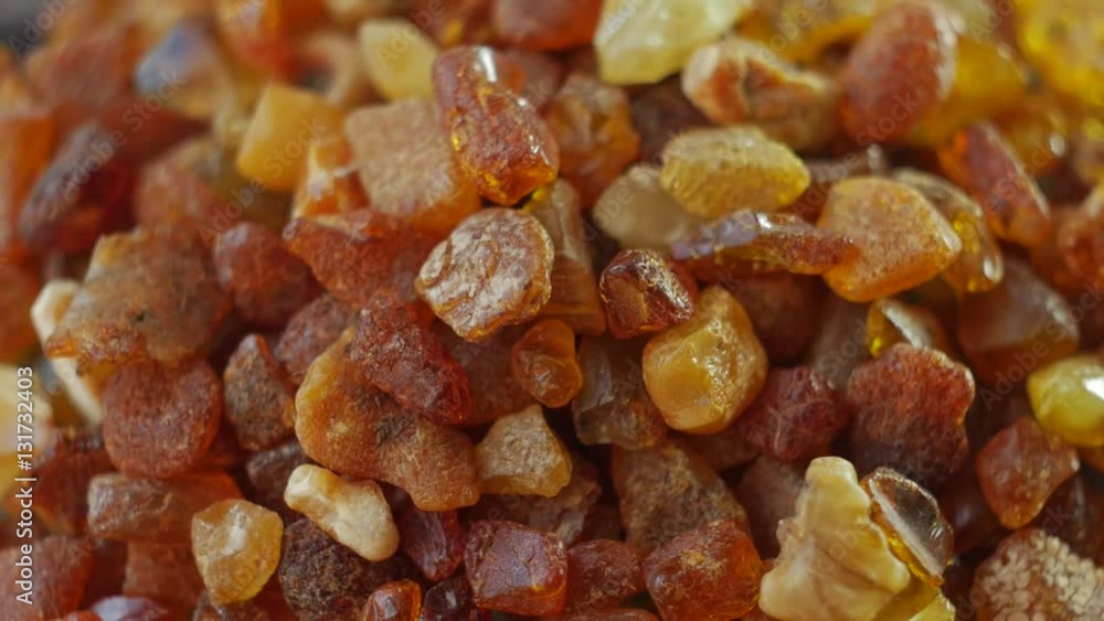 Beautiful Fiery Amber In Macro. From the Baltic Sea, Lithuania. Rotating on the table. Slow motion video. Beautiful Fiery Amber In Macro. From the Baltic Sea, Lithuania. Rotating on the table. Slow motion video.