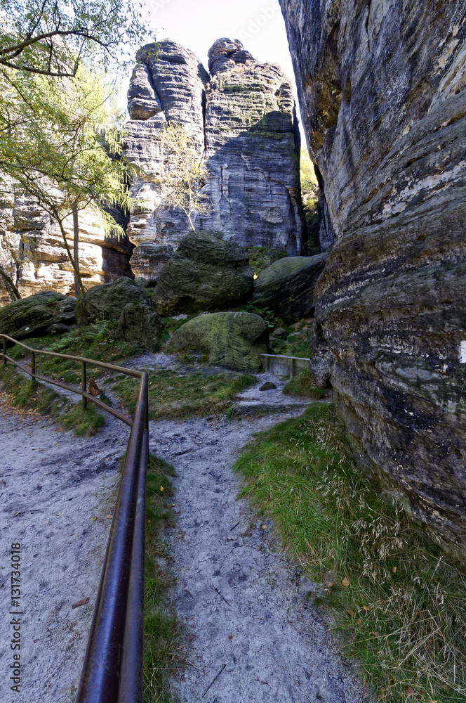 An iron railing going from one side of a rocky landscape An iron railing going from one side of a rocky landscape