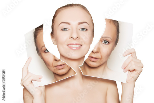 woman breaks photo with her old face and demonstrating pure skin photo