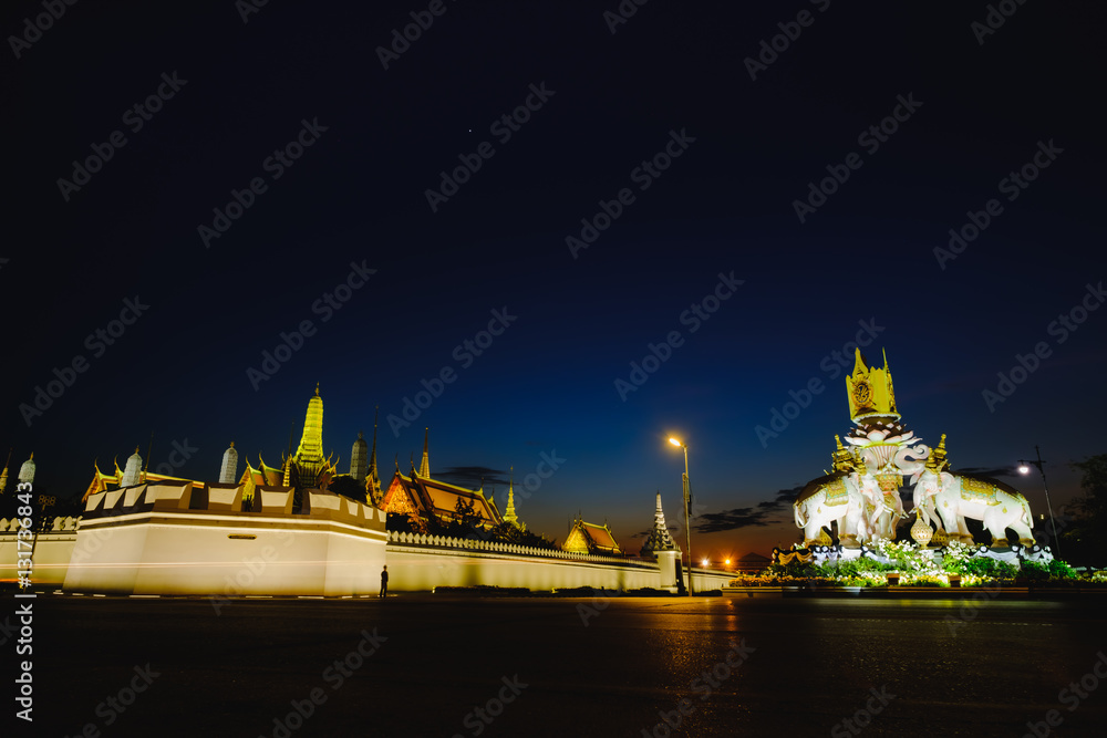 Night view image of  statues of Thai White Elephants and symbols Thailand King Rama 9,in front of the Grand Palace or Emerald Buddha Temple.