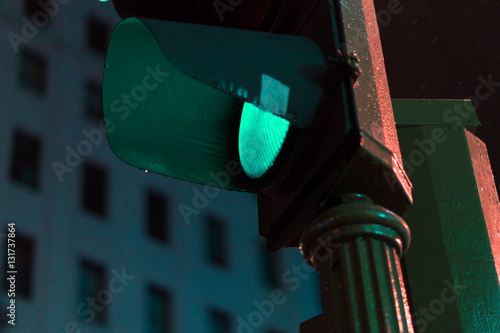 Traffic light with green light. Night.