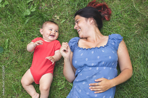 Overhead shot of a mother bonding with her baby son on the grass