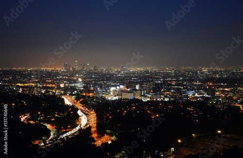 Los Angeles Skyline of Downtown with skyscrapers, urban buildings and traffic on Interstate 101 at night