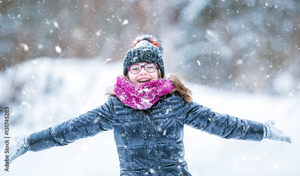 Beauty Winter happy Girl Blowing Snow in frosty winter park or outdoors. Girl and winter cold weather. Beauty Winter happy Girl Blowing Snow in frosty winter park or outdoors. Girl and winter cold weather.