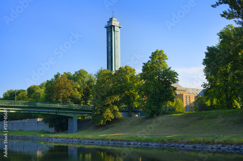 Ostravice river, Komenskeho sady park, Ostrava, Czech Republic / Czechia - evening scenery of beautiful nature of park in the center of the city. Tower, Building of New Town hall, in the background. 
