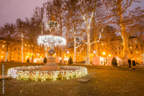 Illuminated fountain and trees in Zrinjevac park, Zagreb, Croatia, Christmas market, Advent  photo