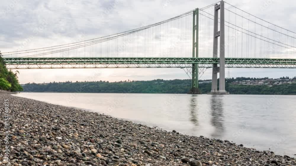 Water Shore Time-Lapse Looking Up at Tacoma Narrows Bridge in Washington State Water Shore Time-Lapse Looking Up at Tacoma Narrows Bridge in Washington State