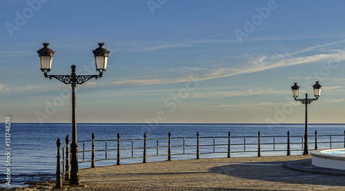 empty quay with lanterns.and Sea View photo