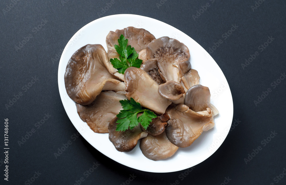 Pickled Oyster Mushrooms laid on a white plate Pickled Oyster Mushrooms laid on a white plate