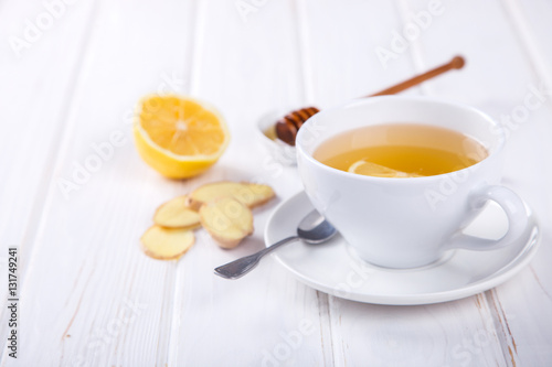 Cup of Ginger Tea with Lemon and Honey on a White Background.Concept Of Healthy Eating. Copy space. selective focus.