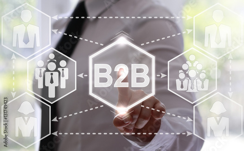 businesswoman presses B2B button on virtual screens. Businessman touched icon business to business on touch screen. Innovation concept presented by a consultant in business on webinar screen. Hexagon.