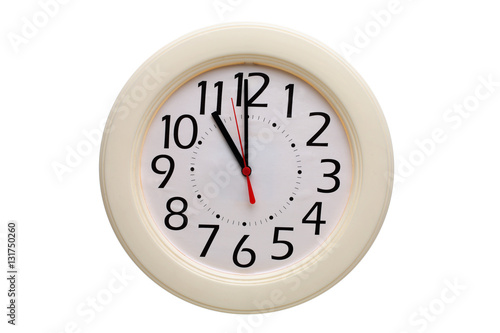 Analog wall clock showing eleven o'clock