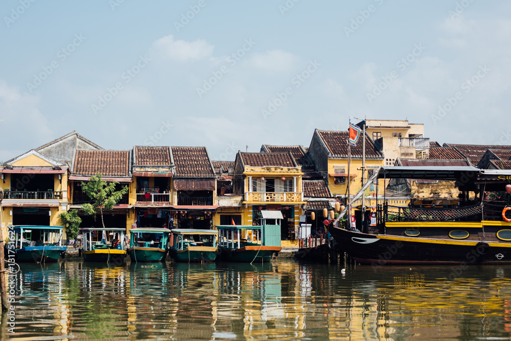 Tourist boats in front of colored houses, asia Tourist boats in front of colored houses, asia