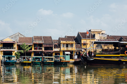 Tourist boats in front of colored houses, asia