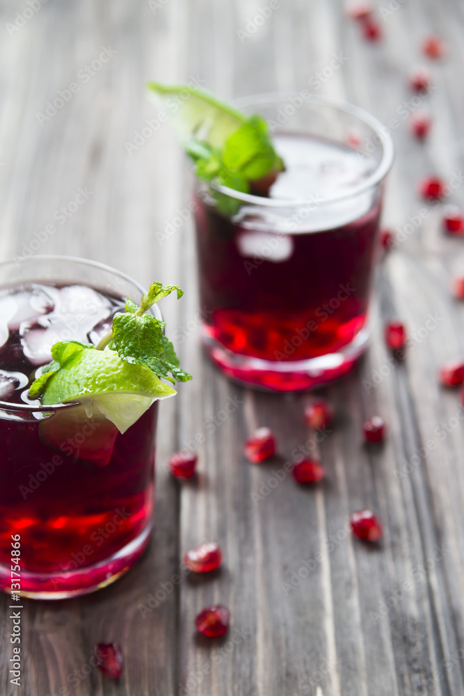 Pomegranate cocktail with pomegranate seeds, lime and mint. alcoholic and non-alcoholic
Pomegranate cocktail with pomegranate seeds, lime and mint. alcoholic and non-alcoholic