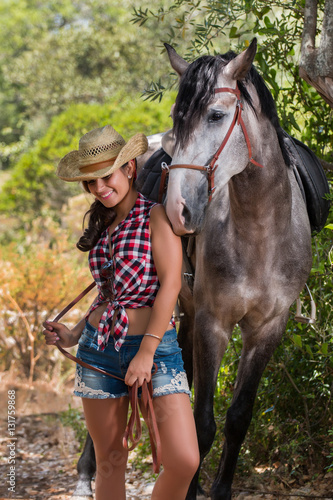 Beautiful girl and horse in nature