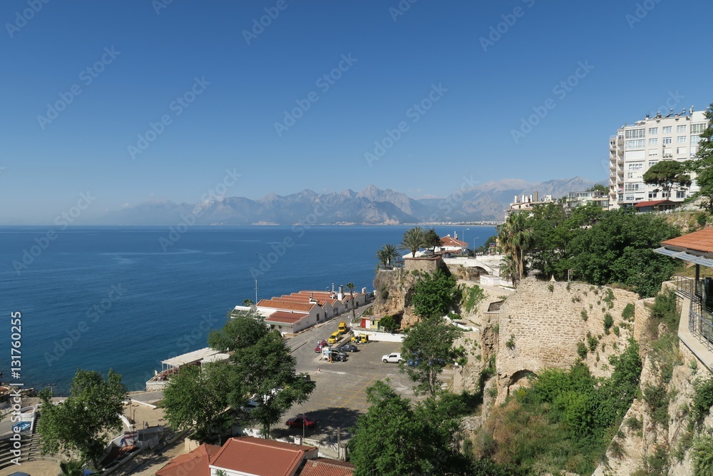 City Walls at the Harbour of Antalya, the 40m High Cliffs and the Taurus Mountains in Turkey