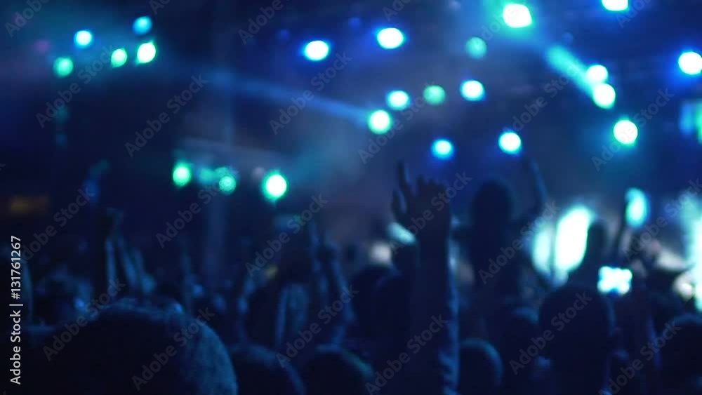 Slow-mo of excited crowd enjoying cool concert, friends hugging and jumping Slow-mo of excited crowd enjoying cool concert, friends hugging and jumping