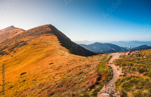 Tourist Hiking Trail in the Mountains on Sunny Day. Low Tatras Ridge  Slovakia.