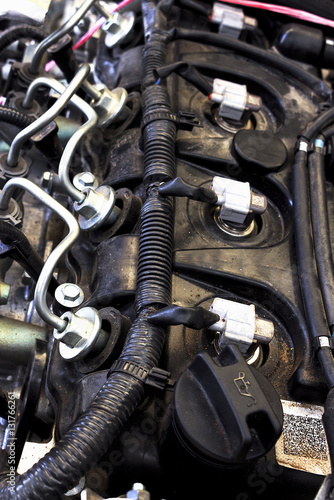 close-up old & grunge car engine in soft-focus in the background. dark tone