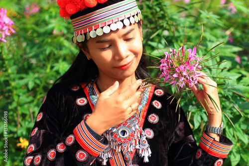 Photos women wear hill tribe costume in flower garden