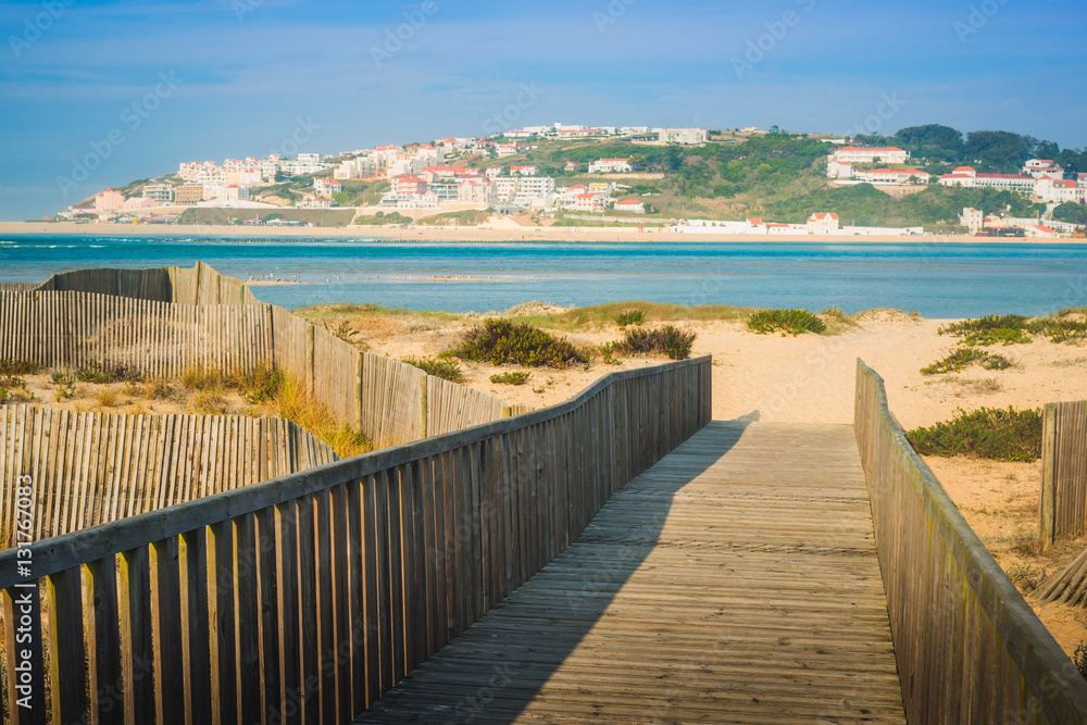 Wooden walking path at the beach. Obidos Lagoon. Portugal