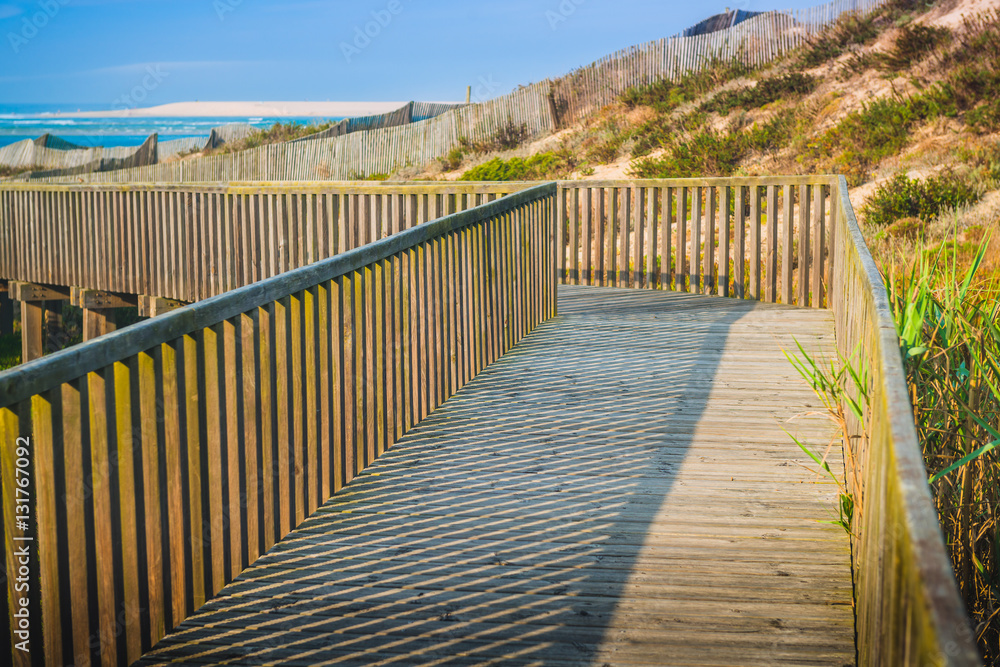 Obraz premium Wooden walking path at the beach. Obidos Lagoon. Portugal