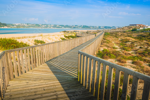 Fototapeta Naklejka Na Ścianę i Meble -  Wooden walking path at the beach. Obidos Lagoon. Portugal