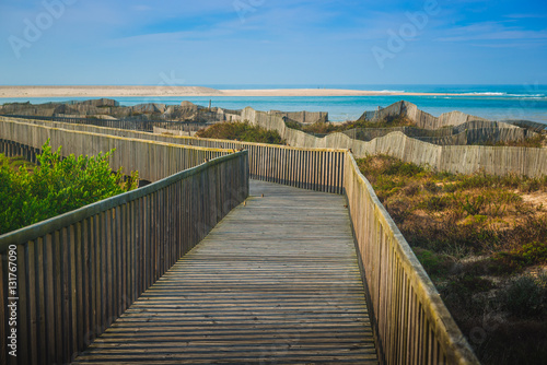 Wooden walking path at the beach. Obidos Lagoon. Portugal