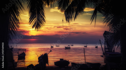 Beautiful sunset with fishing boat  vintage tone