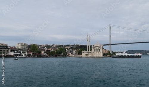 Ortakoy Mosque, Bosphorus Bridge and Strait with Ships, as seen from the European Side of Istanbul, in Turkey