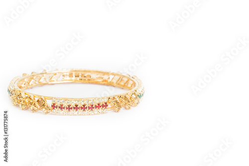 Gold bracelets with gem and diamonds isolate on white background.
