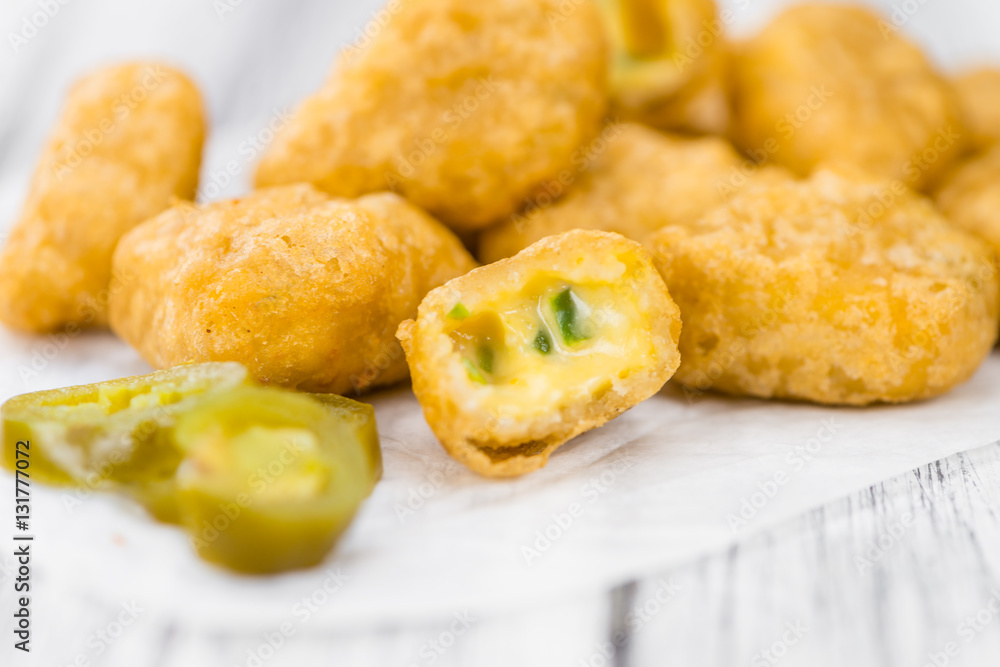 Cheese Nuggets (with Chilis) (selective focus, close-up shot) Cheese Nuggets (with Chilis) (selective focus, close-up shot)