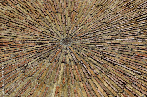 Cobble concentric mosaic. Patterned floor walkway in the park.