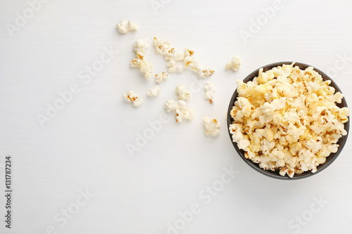 Popcorn in bowl on white background