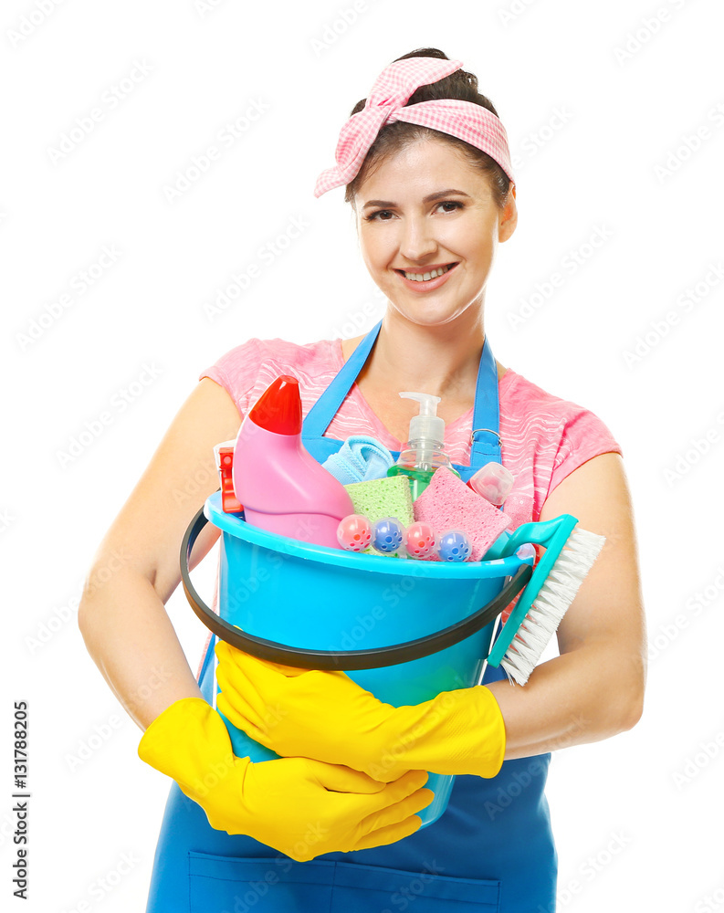 Young cleaner with cleaning supplies in bucket on white background Young cleaner with cleaning supplies in bucket on white background