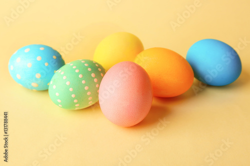 Colorful Easter eggs on yellow background