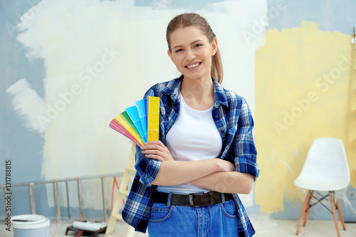 Young female decorator with...