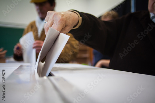 Person voting at polling station photo