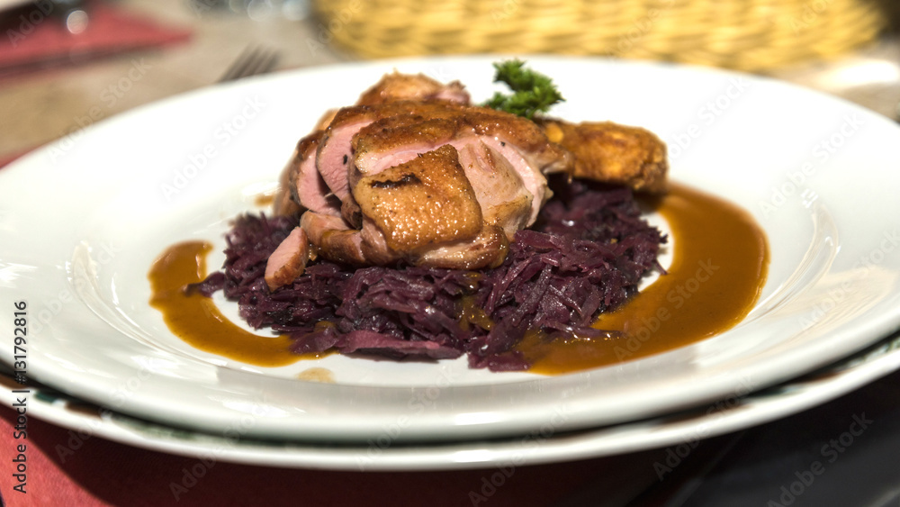 Roast duck on red cabbages