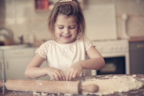 Portrait of girl in kitchen.