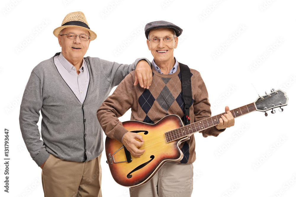 Cheerful seniors playing a guitar Cheerful seniors playing a guitar